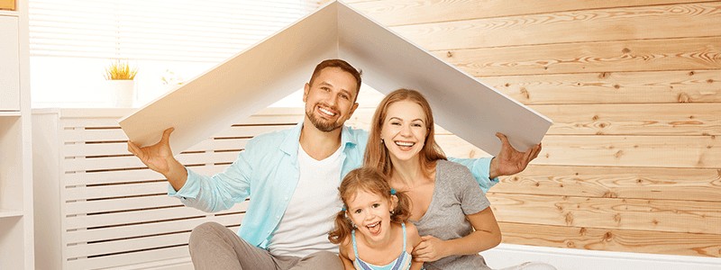 A happy family under a cardbox roof
