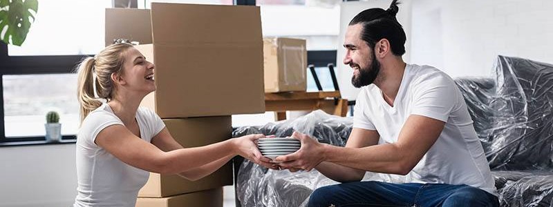 young couple packing up their house for relocation