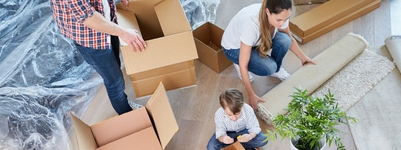 entire family packing their household for a relocation