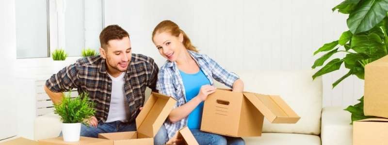 young couple decluttering the household items