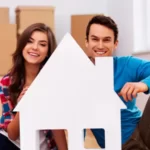 couple looking happy after reaching to their new house