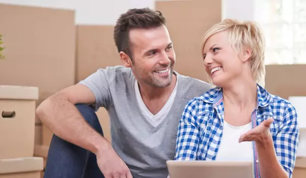 couple sitting on the floor and planning for something
