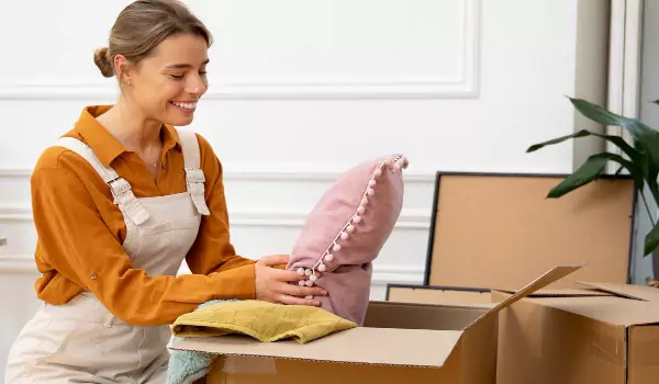 woman packing her household for a move