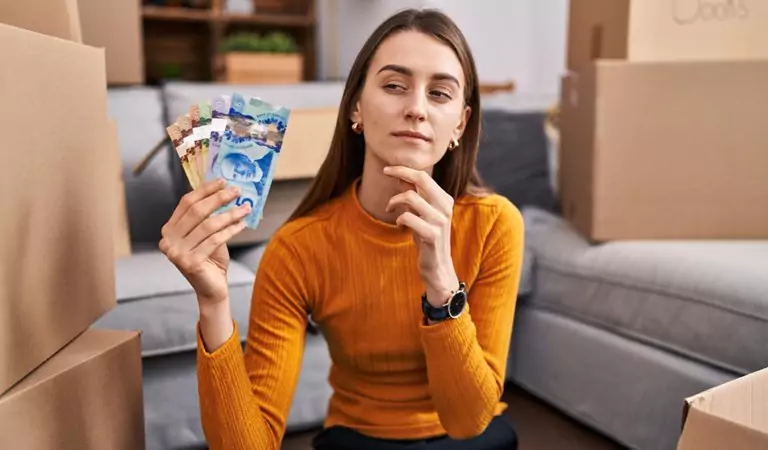 woman with some money thinking about something